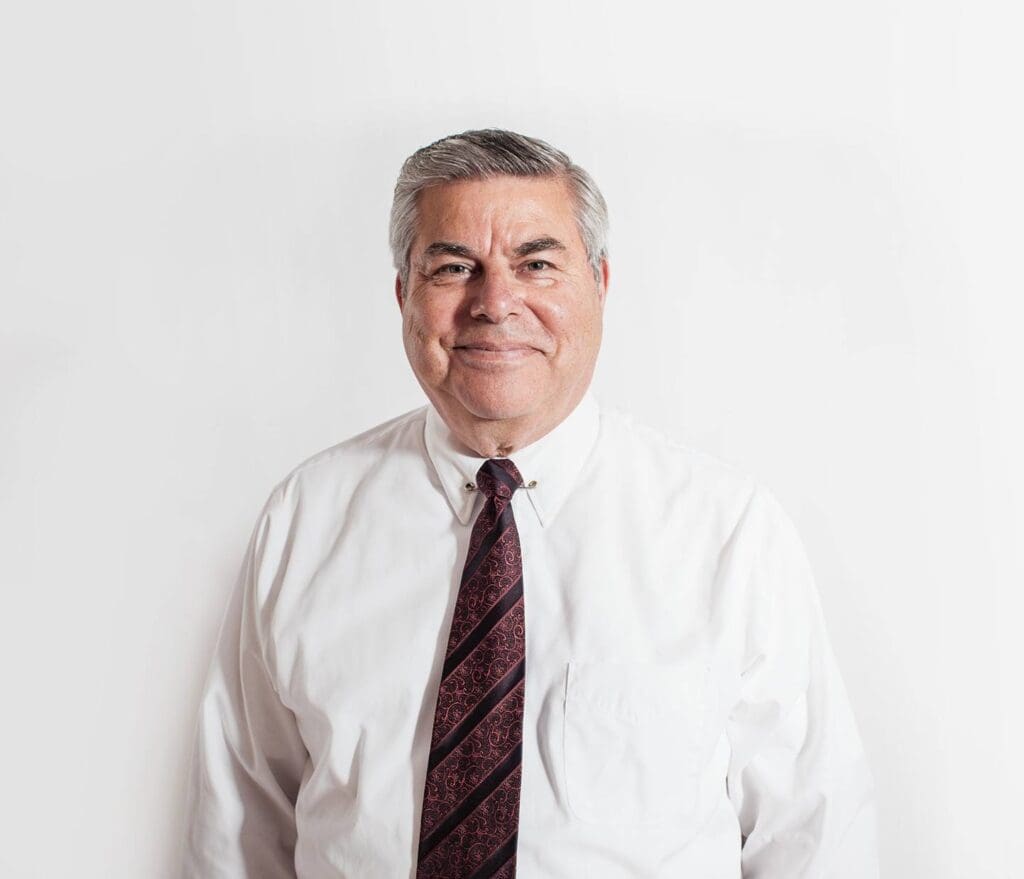 A man in a white shirt and tie.