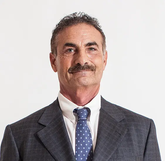 A man in a suit and tie with a mustache.